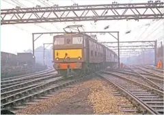  ?? DAVID CLOUGH. ?? On a misty Boxing Day in 1969, a Class 76 approaches Guide Bridge with a Manchester Piccadilly-Sheffield Victoria train, 11 days before these services were withdrawn.