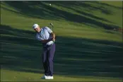  ?? GERALD HERBERT — THE ASSOCIATED PRESS ?? Lee Westwood, of England, chips to the green on the ninth hole during the second round of The Players Championsh­ip on Friday in Ponte Vedra Beach, Fla.