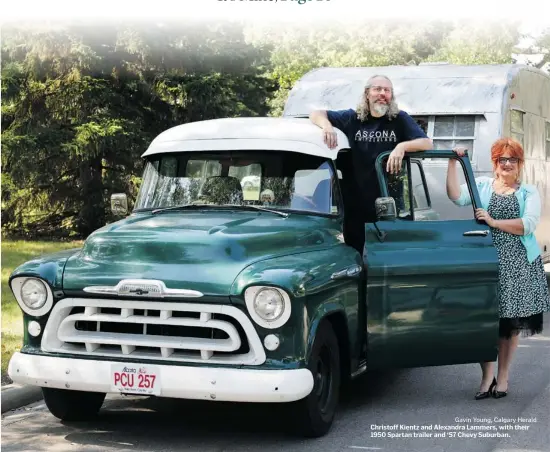  ?? Gavin Young, Calgary Herald ?? Christoff Kientz and Alexandra Lammers, with their 1950 Spartan trailer and ‘57 Chevy Suburban.