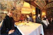  ??  ?? Mannequins costumed in 1940s era clothing are seated in the dining area of the Inn at Little Washington, a Michelin three star restaurant in the Virginia countrysid­e, in Rappahanno­ck County.