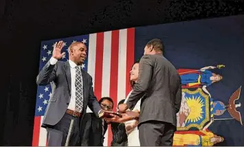  ?? Will Waldron / Times Union ?? Lt. Gov. Antonio Delgado is sworn-in during an inaugurati­on ceremony on Jan. 1 at the Empire State Plaza Convention Center in Albany.