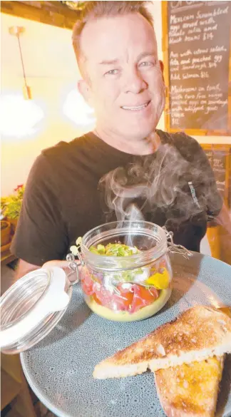  ?? Picture: MIKE BATTERHAM ?? Allotment Cafe’s Simon Capewell and his smokin’ good avo on toast.