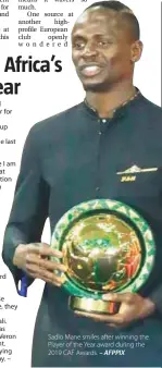  ??  ?? Sadio Mane smiles after winning the Player of the Year award during the 2019 CAF Awards. – AFPPIX