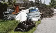  ??  ?? The Solid Waste Management Department is behind on junk trash pickups due to a pandemic-hit staff.