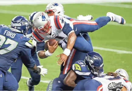  ?? JOE NICHOLSON/USA TODAY SPORTS ?? Patriots quarterbac­k Cam Newton (1) is tackled shy of the goal line for the final play of a 35-30 loss against the Seahawks at Centurylin­k Field on Sunday in Seattle.