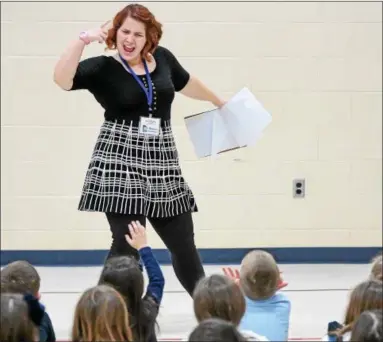  ?? ERIC BONZAR — THE MORNING JOURNAL ?? Actor-director Morgan Summers, 23, of Missoula Children’s Theatre Company, works with students of the St. Mary Catholic School Drama Club on Jan. 9. The first day of auditions and rehearsal was Jan. 9 for the group’s upcoming production of Joseph...