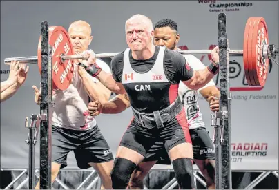  ?? IPF PHOTO/SUBMITTED BY RON DELANEY ?? Ron Delaney of Sydney attempts a 391-pound squat while competing at the 2018 Internatio­nal Powerlifti­ng Federation Classic World Championsh­ips in Calgary on June 7. Delaney won gold in the Master 3 83 kg class for his seventh world title.