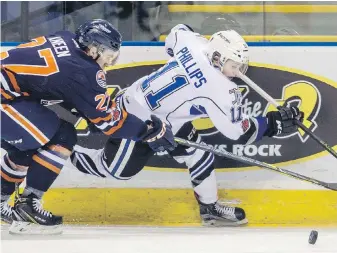  ?? DARREN STONE, TIMES COLONIST ?? Victoria Royals’ Matthew Phillips gets past Kamloops Blazers’ Nolan Kneen at Save-on-Foods Memorial Centre on Saturday night.