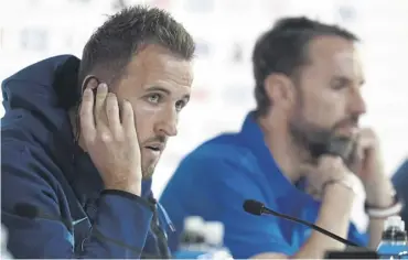  ?? ?? ↑ Kane, left, and England manager Gareth Southgate face the media yesterday