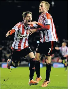  ?? Picture: GETTY IMAGES ?? GOLDEN GOAL: Sunderland’s Fabio Borini, left, celebrates with Sebastian Larsson after scoring from the penalty spot during their League Cup semifinal first leg match against Manchester United at the Stadium of Light