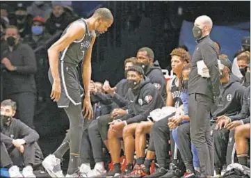  ?? AP ?? Nets’ Kevin Durant leaves Saturday night’s game after injuring his knee. He will undergo an MRI today.