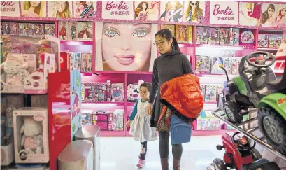  ?? NG HAN GUAN THE ASSOCIATED PRESS FILE PHOTO ?? Mattel, maker of Barbie dolls, shut manufactur­ing sites in China and Indonesia last year. The company also said it would close a facility in Montreal sometime this year as it reduces its sprawling manufactur­ing footprint to cut costs.