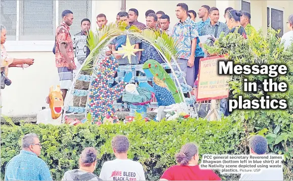  ?? Picture: USP ?? PCC general secretary Reverend James Bhagwan (bottom left in blue shirt) at the Nativity scene depicted using waste
plastics.