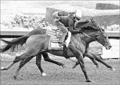  ?? BARBARA D. LIVINGSTON ?? Game Winner (outside) works five furlongs in 59.80 seconds on Sunday morning at Los Alamitos.