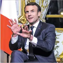  ?? CHRISTOPHE PETIT TESSON, POOL VIA AP ?? French President Emmanuel Macron gestures Friday at the Elysee Palace in Paris.