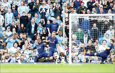  ?? LINDSEY PARNABY/AFP ?? Manchester City’s Brazilian striker Gabriel Jesus (left) shoots to score, but has the goal overuled by VAR, during the Premier League football match against Tottenham Hotspur at the Etihad Stadium in Manchester, north west England, on Saturday.