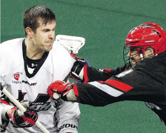  ?? RYAN MCLEOD/ FILES ?? Wesley Berg, right, and the Roughnecks face a big game with playoff implicatio­ns against Matt Beers and the Vancouver Stealth Saturday in Langley, B.C.