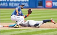  ?? AP PHOTO/ADAM HUNGER ?? Atlanta Braves' Ronald Acuna Jr. steals second base behind New York Mets second baseman Jonathan Arauz during the first game of Saturday's doublehead­er in New York.