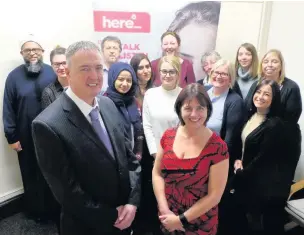  ??  ?? ●● Police and Crime Commission­er Clive Grunshaw, left, with Claire Powell of Victim Support, and Lancashire Victim Support staff