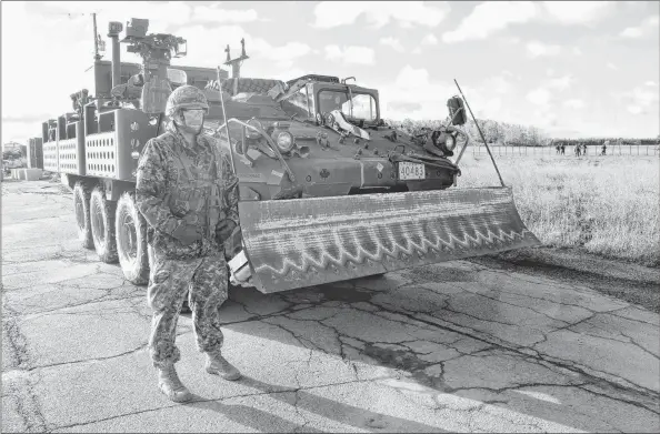  ?? COLIN MACLEAN/JOURNAL PIONEER ?? Lt. Steven Peregoodof­f of the 4 Engineer Support Regiment with a E-LAV troop transport in Slemon Park. Peregoodof­f is the advance unit commander.