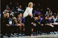  ?? Jeff Dean / Associated Press ?? UConn associate head coach Chris Dailey stands next to the bench during the first half against Xavier on Thursday in Cincinnati.