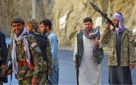  ?? — AP ?? Militiamen loyal to Ahmad Massoud, son of Ahmad Shah Massoud, stand guard in Panjshir province northeaste­rn of Afghanista­n, on Wednesday. The Panjshir Valley is the last region not under Taliban control following their stunning blitz across Afghanista­n.