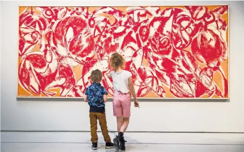  ??  ?? Lee Krasner’s painting “Combat,” left, stands four meters wide. The work is part of a major touring retrospect­ive. Below, Krasner circa 1938, when she studied with Hans Hofmann.