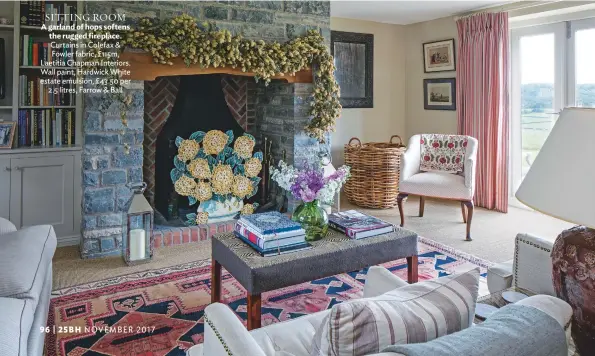  ??  ?? sitting room A garland of hops softens the rugged fireplace. Curtains in Colefax & Fowler fabric, £115m, laetitia Chapman interiors. Wall paint, Hardwick White estate emulsion, £ 43.50 per 2.5 litres, Farrow & Ball