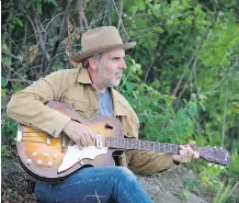 ??  ?? Alberta singer-songwriter John Wort Hannam shines on his new album Love Lives On. Becoming a father three years ago indirectly inspired many of the heartfelt songs on the album, he says.