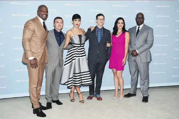  ?? EVAN AGOSTINI/THE ASSOCIATED PRESS ?? Brooklyn Nine-Nine cast members Terry Crews, left, Joe Lo Truglio, Stephanie Beatriz, Andy Samberg, Melissa Fumero and Andre Braugher got good news when their cancelled series was picked up by NBC after fans rallied to save it.