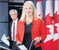  ?? CP PHOTO ?? Natural Resources Minister James Carr and Minister of Environmen­t and Climate Change Catherine McKenna prepare to hold a joint news conference on pipelines in Ottawa Wednesday.