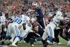  ?? AP PHOTO/ STEVEN SENNE ?? New England Patriots quarterbac­k Tom Brady leaps over the line of scrimmage for a touchdown against the Indianapol­is Colts during the first half of an NFL game, Thursday in Foxborough, Mass.