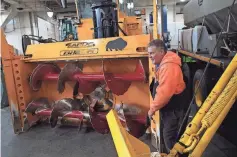  ?? DEREK GEE/AP ?? Operator Don Beitz prepares a giant snow thrower to take on the several feet of snow expected to hit the New York State Thruway in western New York.