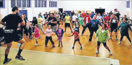  ??  ?? Personal trainer Jermaine Robinson leads a class at the Mahitahi initiative in Pomare.