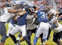  ?? STACEY WESCOTT/CHICAGO TRIBUNE ?? The Bears’ Khalil Mack, Danny Trevathan and Eddie Goldman stop Dalvin Cook behind the line of scrimmage last season.