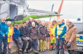  ?? Photo / Ruapehu Alpine Rescue ?? Nga¯ti Hikairo kaumatua Te Ngaehe Wanikau (right) says a karakia at Mt Tongariro. He is flanked by Senior Constable Barry Shepherd and members of LandSAR and Ruapehu Alpine Rescue Organisati­on.