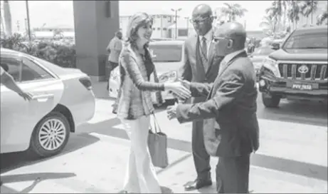  ?? (Department of Public Informatio­n photo) ?? Vice President and Minister of Foreign Affairs, Carl Greenidge (right) greets Colombian Minister of Foreign Affairs, María Ángela Holguín.