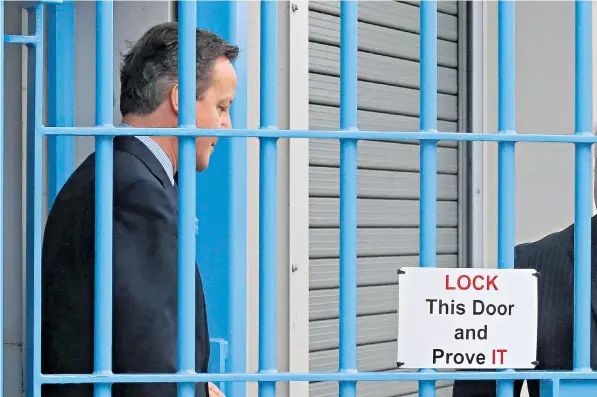  ??  ?? David Cameron yesterday visited HM Prison Onley in Rugby as he announced major proposed reforms to the penal system, including releasing more criminals earlier and fitting them with satellite tags to monitor them