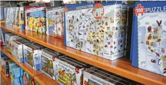  ?? Elizabeth Conley / Staff photograph­er ?? Retailers have had a hard time keeping jigsaw puzzles in stock during the pandemic.