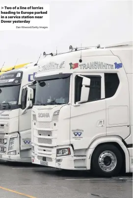  ?? Dan Kitwood/Getty Images ?? Two of a line of lorries heading to Europe parked in a service station near Dover yesterday