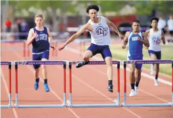  ?? ADOLPHE PIERRE-LOUIS/JOURNAL ?? Noah Fay, center, of Rio Rancho, shown winning the 300-meter hurdles event Monday at the Marilyn Sepulveda meet at UNM, will compete this weekend at the Richard A. Harper meet at Academy.