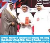  ??  ?? KUWAIT: Minister of Commerce and Industry and Acting State Minister of Youth Affairs Khaled Al-Roudhan honoring Zain represente­d by Zain’s Corporate Communicat­ions and Relations Director Waleed Al-Khashti.