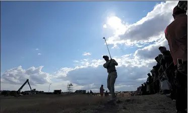  ?? AP/JON SUPER ?? Tiger Woods plays from the rough on the 14th hole at Carnoustie on Wednesday during a practice round of the British Open. Woods said he doesn’t plan to use his driver often because of how far the ball is rolling across tight links grass that looks dead.