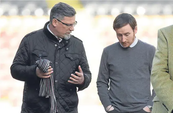 ??  ?? The appointmen­t of Ian Cathro, pictured with director of football Craig Levein, was hailed as innovative.