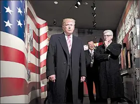  ?? AP/SUSAN WALSH ?? President Donald Trump tours the newly opened Mississipp­i Civil Rights Museum on Saturday in Jackson with Mississipp­i Gov. Phil Bryant and others.