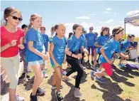  ??  ?? A group of North Star Elementary chapter of Girls on the Run Rio Grande begin a 5K run.