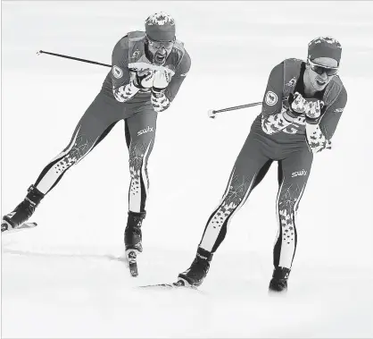  ?? BUDA MENDES GETTY IMAGES ?? Brian McKeever and his guide, Graham Nishikawa, compete in the 20-km free, visually impaired event at Alpensia Biathlon Centre Monday.