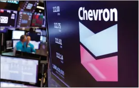  ??  ?? The logo for Chevron appears above a trading post on the floor of the New York Stock Exchange in this file photo. The acquisitio­n of Noble Energy is expected to strengthen Chevron’s position in the Mediterran­ean as well as in the U.S.’ Permian Basin and DJ Basin.
(AP)