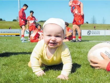  ?? Photo / Dan Hutchinson ?? Seven-month-old Lucas Clayton-Ford gets into the spirit of things at the the Global Games Junior Rugby Festival in Taupo.