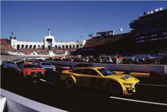  ?? Jared C. Tilton / Getty Images ?? Joey Logano, driver of the No. 22 Shell Pennzoil Ford, races during the NASCAR Cup Series Busch Light Clash on a quarter-mile track inside the Los Angeles Memorial Coliseum.